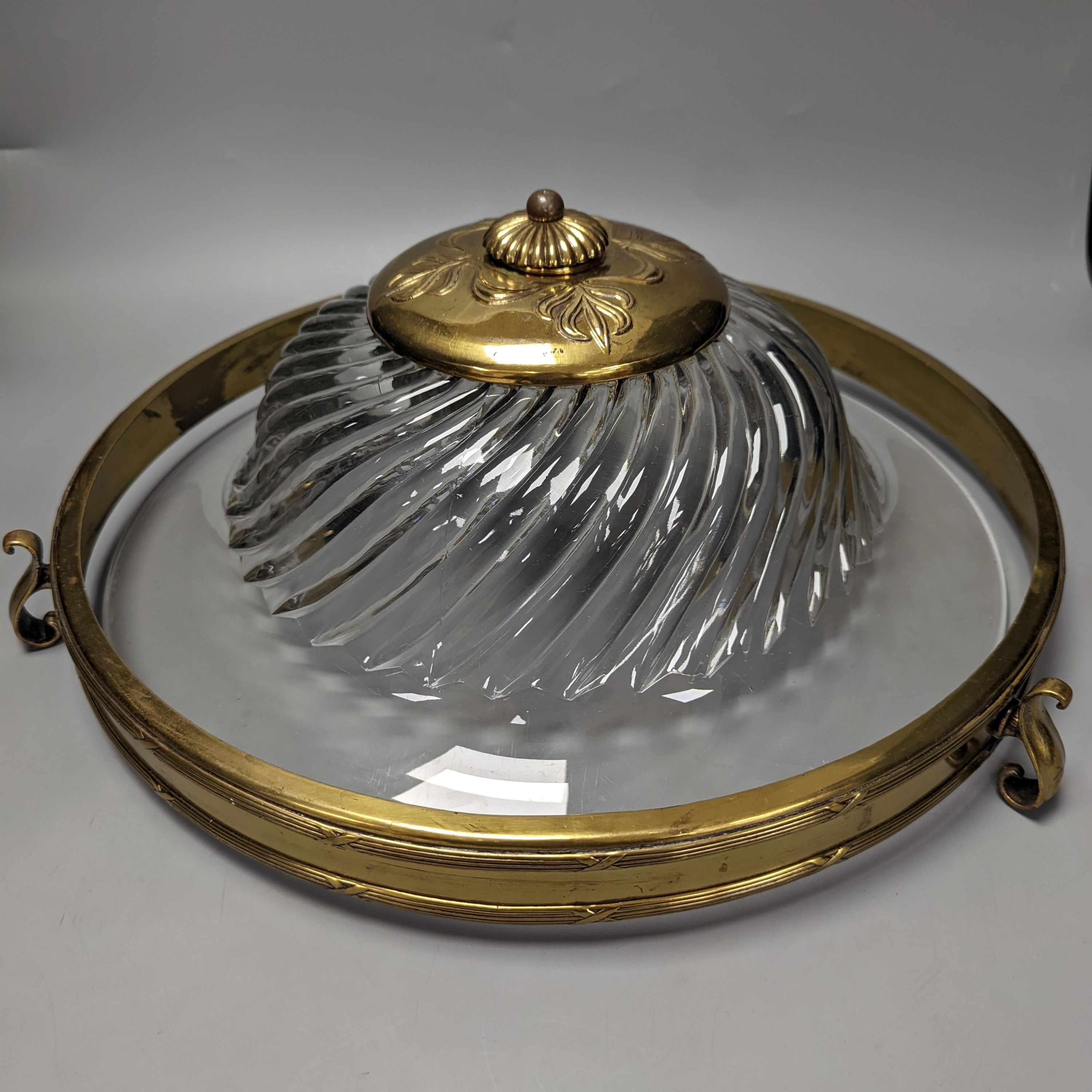 A circular brass and glass plathonier, first half 20th century , 42 cms diameter.